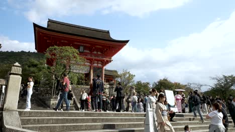 Tourists-climb-stair-leading-to-Kiyomizu-dera-Temple-pagoda-in-Kyoto,-Japan