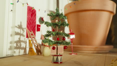 Scandinavian-Nisse-Christmas-tree-and-mailbox,-quaint-holiday-shadow