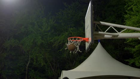 Basketball-flying-into-the-basketball-hoop