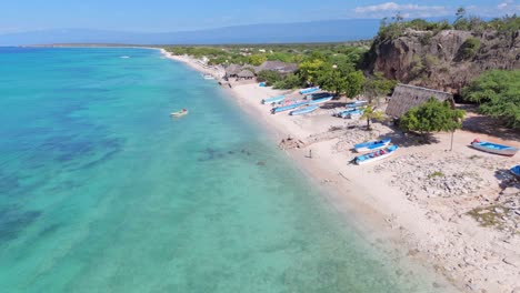 Aerial-flyover-sandy-beach,-caribbean-sea-and-fisherman-cave-in-Pedernales,-Dominican-Republic