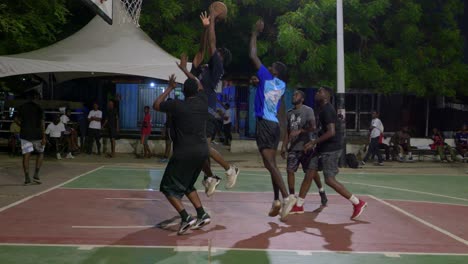 Slow-motion-of-successful-defense-action-in-basketball-game-team-black-people-play-together-at-night