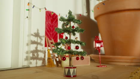 Scandinavian-Nisse-Christmas-tree-and-mailbox,-quaint-holiday-shadow