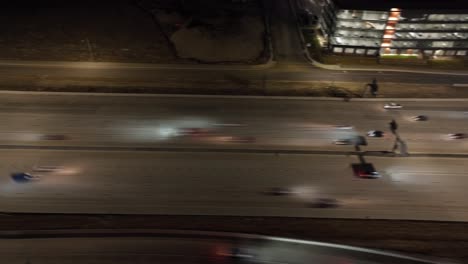 Nighttime-highway-traffic---tilt-down-aerial-hyper-lapse