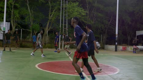Slow-motion-basketball-solitary-actions-team-of-friends-play-outdoor-sport-at-night