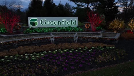Aerial-panning-shot-of-Greenfield-Sign-in-Office-Business-Park-decorated-with-Christmas-lights---Lancaster,-USA