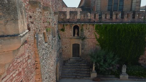 Slow-revealing-shot-of-a-side-entrance-to-the-beautiful-Chateau-de-Pouzilhac
