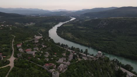 Drone-view-of-Pocitelji-castle-and-historical-mosque-on-the-river-bank-near-Mostar,-Bosnia-and-Herzegovina