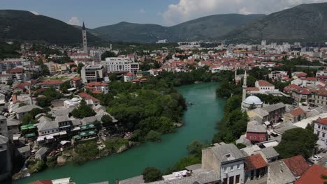 Drone-view-of-Mostar-Bridge-in-the-Balkans,-historical-bridge-built-over-the-river