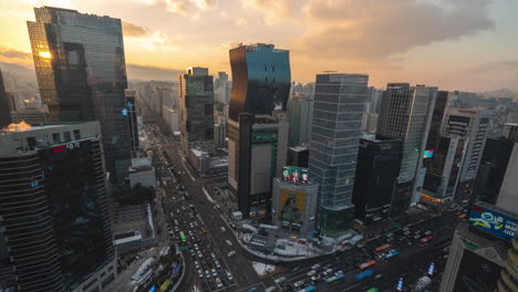 Seoul-City-Rooftop-View-of-Cars-Traffic-on-Gangnam-Station-Crossroads-at-Sunset---timelapse