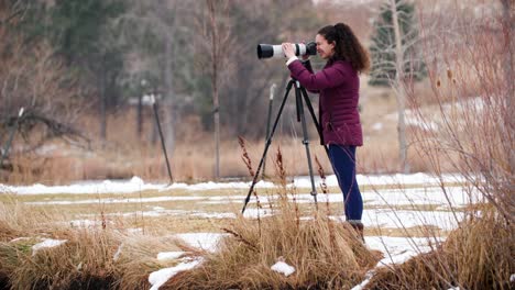 Female-Photographer-Taking-Pictures-During-Cold-Winter-Day