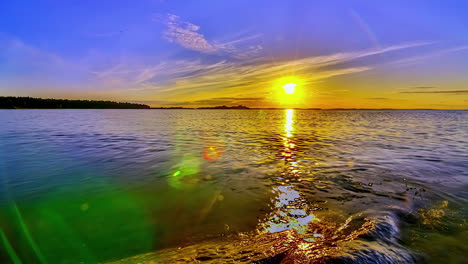 Magical-lake-sunset-with-colorful-sky,-hyper-lapse-following-sun