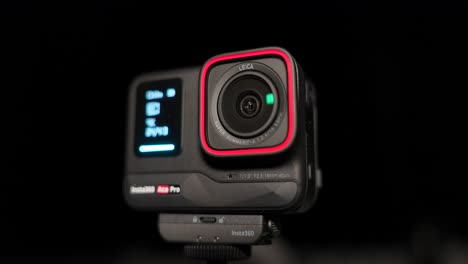 Close-up-of-innovative-and-creative-Insta360-Ace-Pro-action-camera-on-black-background