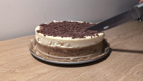 Using-sharp-knife-to-cut-delicious-cake,-static-view