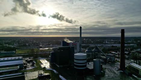 Industrial-plant-emits-deadly-smoke-into-atmosphere,-aerial-view