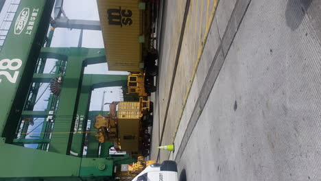 Container-lifting-Mediterranean-Shipping-Company-by-gantry-crane,-Panama-Canal