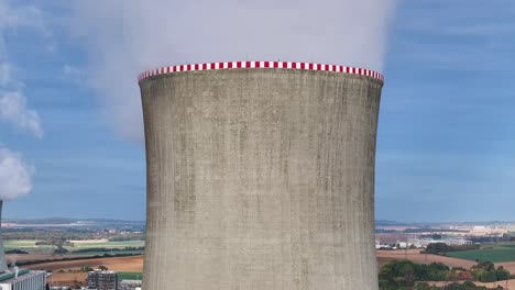 Aerial-reveal-of-multiple-nuclear-power-plant-facility-cooling-towers