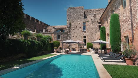 Slow-establishing-shot-of-a-private-pool-in-the-garden-of-Chateau-de-Pouzilhac