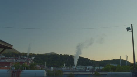Establishing-shot-of-Celanese-factory-releasing-smoke-into-the-atmosphere---wide-shot