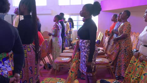 African-women-standing-at-a-concert-of-music-and-lights