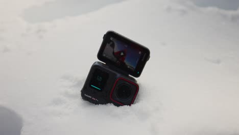 Small-compact-nsta360-Ace-Pro-action-camera-on-snow