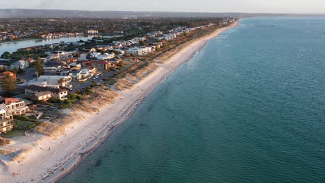 Aerial-of-Tennyson-Beach-and-suburbs-at-sunset-in-Adelaide,-South-Australia