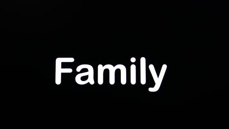 Typing-on-screen-with-black-background-written-Family