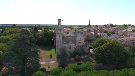 Slow-orbiting-shot-revealing-the-historic-Chateau-de-Pouzilhac-in-the-city