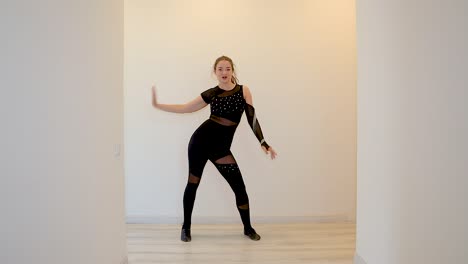 Dance-teacher-dancing-alone-in-slow-motion-from-home-teaching-an-online-dance-class