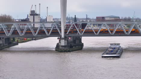 Train-bridge-at-Dordrecht-spans-across-the-water-as-vessel-goes-under