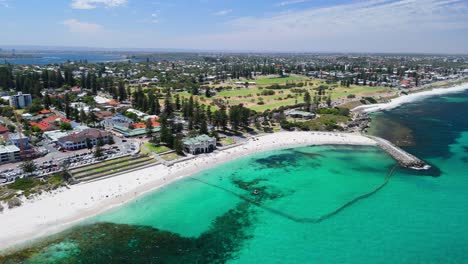 Drone-view-of-Cottesloe-beach-and-golf-course-with-city-skyline-in-the-background