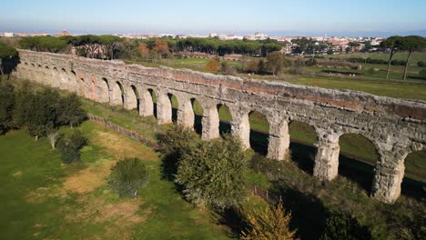 Drone-Flies-Over-Claudio-Aqueduct-on-Beautiful-Sunny-Day-in-Rome,-Italy