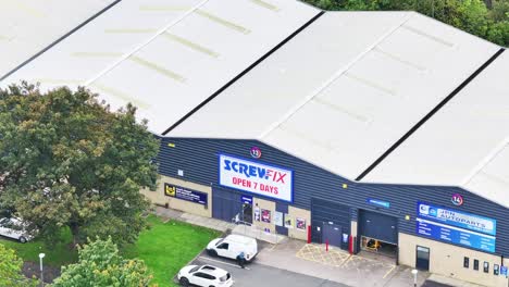Screwfix-Huddersfield,-Birkby-Hardware-store,-sunny-drone-overview-aerial-shot,-open-7-days-sign
