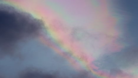 Multicolor-rainbow-clouds-iridescence-passing-in-the-sky