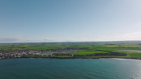 4K-Static-Aerial-of-Seahouses,-United-Kingdom-on-a-sunny-afternoon