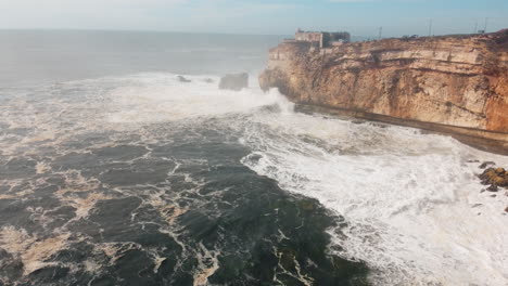 Fort-of-Sao-Miguel-Arcanjo-In-Nazare,-Portugal-With-Waves-Crashing