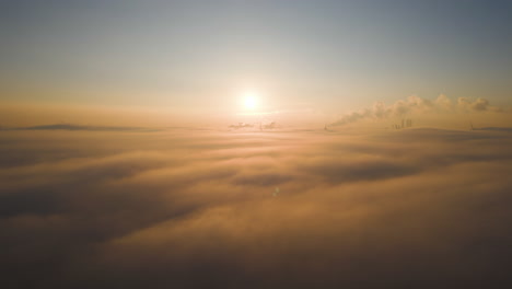 Beautiful-Golden-Sunrise-Above-Low-Level-Cloudy-Mist-Layer-Aerial-View