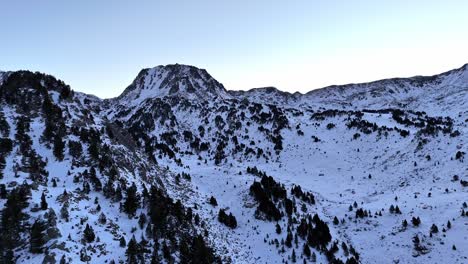 Drone-footage-of-snowy-mountains-at-dawn-in-the-Pyrenees-mountains