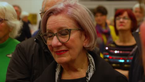 Older-lady-with-pink-grey-hair-and-modern-design-glasses-close-up