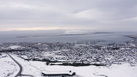 4K-Wide-Push-In-of-Tórshavn-town-covered-in-Snow,-Faroe-Islands