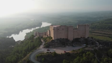 Arriving-at-Miravet-Castle-on-banks-of-the-Ebro-River-on-a-misty-morning