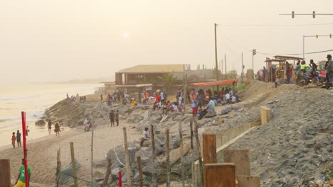 african-people-gathering-at-sunset-in-Sakumono-beach-estabnlished-footage
