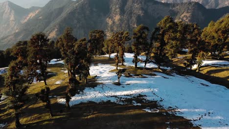 aerial-drone-camera-cinematic-shot-chopta-utrakhand-where-many-mountains-and-land-are-seen-covered-with-snow