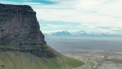 Vatnajokull-glacier-shot-through-Lomagnupur---Drone-4k---South-Iceland