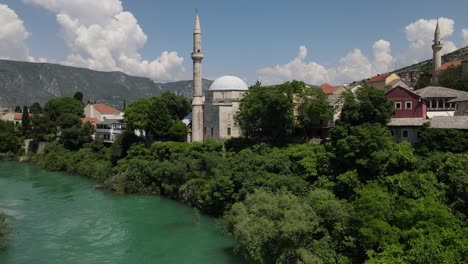 Important-mosques-of-the-city-of-Mostar-in-Bosnia,-aerial-drone-view-ottoman-architecture-of-Mostar-is-a-beautiful-city-in-Europe