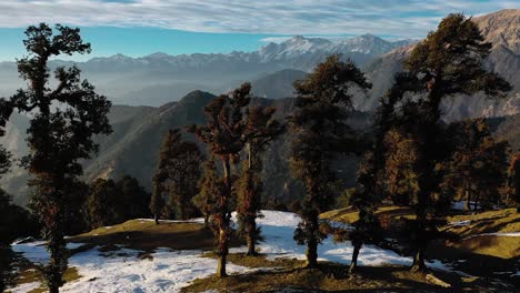 aerial-drone-camera-cinematic-shot-chopta-utrakhand-drone-camera-maintain-distant-mountains-and-dawn-camera-and-moving-from