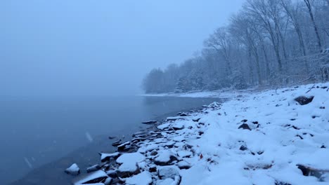 Beautiful-snowfall-timelapse-on-a-pristine-mountain-lake