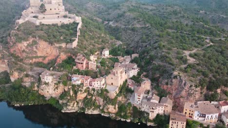 Drone-view-of-Miravet-Castle-and-village-in-Tarragona,-Spain