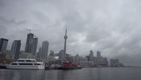 Toronto-river-harbour-pier-downtown-city-skyline-fishing-trawler-dock-waterfront-Ireland-Park-Lake-Ontario-Canada