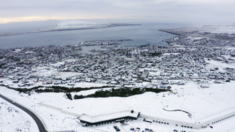 4K-Slow-Orbit-of-Tórshavn-town-covered-in-Snow,-Faroe-Islands