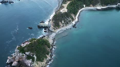 scenic-aerial-coastline-cliff-seascape-in-Jalisco-mexico-san-Patricio-barra-de-navidad-tourist-travel-holiday-destination-drone-reveal-amazing-ocean-beach